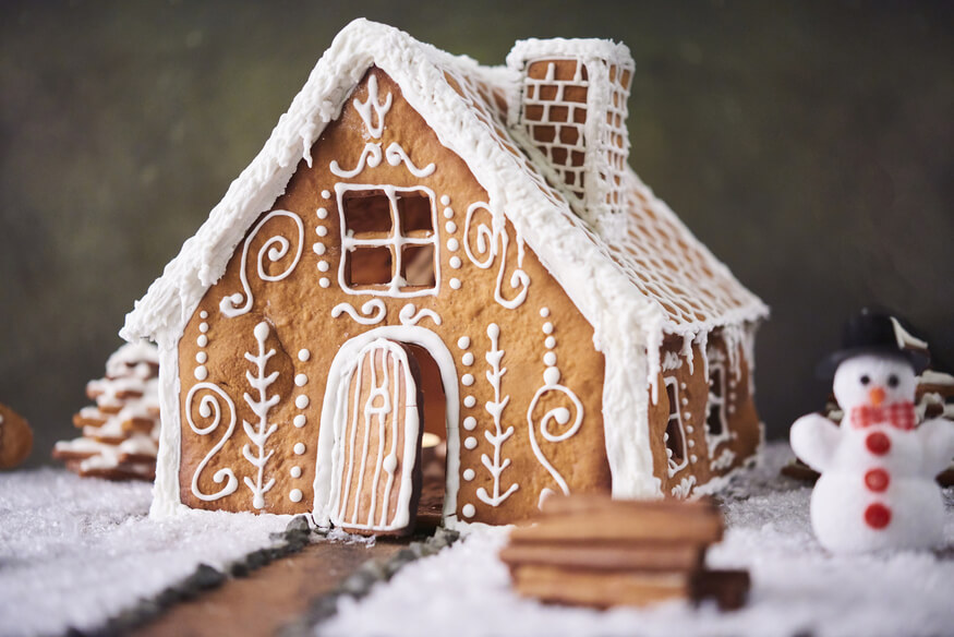 This image shows a decorated gingerbread house, representing an effective Christmas fundraising idea.